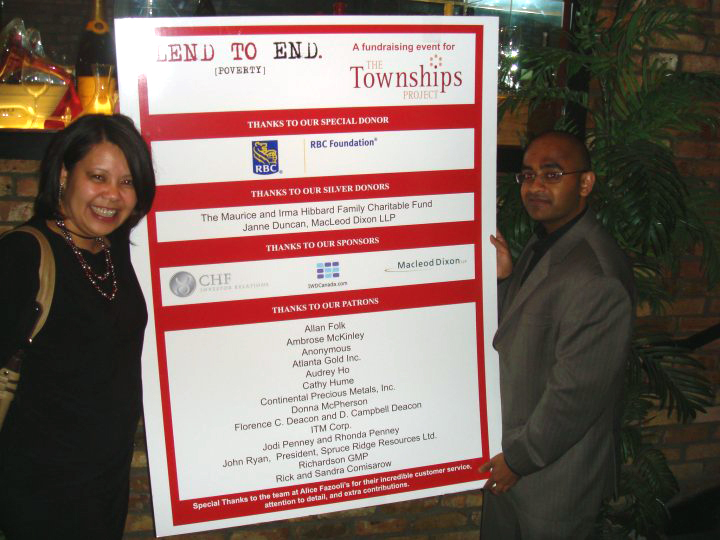 Jeanny and Brian holding the Board